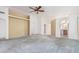 Spacious living room featuring plush carpeting, a ceiling fan, and an open floor plan at 3349 E Lavey Ln, Phoenix, AZ 85032