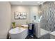 Stylish bathroom with a modern soaking tub, glass-enclosed shower, and elegant finishes, perfect for relaxation at 3630 N 39Th St, Phoenix, AZ 85018