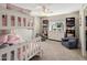 Charming bedroom featuring a cozy bunk bed, bookshelves, and seating, offering a functional and inviting space at 3630 N 39Th St, Phoenix, AZ 85018