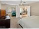 Spacious bedroom with white French doors, a comfortable chair, and a seating area, creating a serene retreat at 3630 N 39Th St, Phoenix, AZ 85018