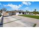 Spacious driveway leads to a covered carport, providing ample parking and easy access to the home at 3630 N 39Th St, Phoenix, AZ 85018
