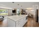 Open-concept kitchen with a large center island, modern appliances, and seamless flow to dining and living areas at 3630 N 39Th St, Phoenix, AZ 85018