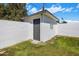 A white painted brick storage building with a gray door provides extra space at 3630 N 39Th St, Phoenix, AZ 85018