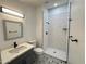 Modern bathroom features sleek vanity, decorative tile floor, and a walk-in shower at 3646 N 69Th Ave # 70, Phoenix, AZ 85033