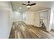 Spacious bedroom featuring wood flooring, a ceiling fan, and natural light at 3646 N 69Th Ave # 70, Phoenix, AZ 85033