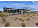 Modern home backyard featuring a desert landscape and sleek architectural design at 37200 N Cave Creek Rd # 1019, Scottsdale, AZ 85262