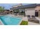 Gorgeous backyard with a sparkling pool, fire pit, and inviting lounge chairs at 37200 N Cave Creek Rd # 1019, Scottsdale, AZ 85262