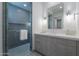 Modern bathroom featuring a glass-enclosed shower, neutral vanity, and contemporary finishes at 37200 N Cave Creek Rd # 1019, Scottsdale, AZ 85262