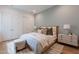 Inviting bedroom with soft blue walls, a plush bed, neutral decor and a striped rug at 37200 N Cave Creek Rd # 1019, Scottsdale, AZ 85262