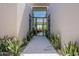 Inviting entryway with modern design and desert landscaping, offering a glimpse into the bright living area at 37200 N Cave Creek Rd # 1019, Scottsdale, AZ 85262