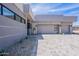 Modern home showcasing a dual-car garage, desert landscaping, and a neutral color palette for elegance at 37200 N Cave Creek Rd # 1019, Scottsdale, AZ 85262