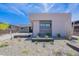 Landscaped front yard featuring desert plants and modern architecture with stone accents, offering curb appeal at 37200 N Cave Creek Rd # 1019, Scottsdale, AZ 85262