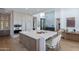 Bright, modern kitchen with white countertops, stainless steel appliances, and a stylish island with seating at 37200 N Cave Creek Rd # 1019, Scottsdale, AZ 85262