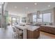 Bright, airy kitchen with island seating, stainless steel appliances, and a seamless transition to the dining area at 37200 N Cave Creek Rd # 1019, Scottsdale, AZ 85262