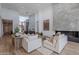 Bright living room featuring a stone fireplace, comfortable seating, and an open-concept design with high ceilings at 37200 N Cave Creek Rd # 1019, Scottsdale, AZ 85262