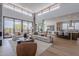 Bright, open-concept living room featuring high ceilings, modern decor, and seamless access to the outdoors at 37200 N Cave Creek Rd # 1019, Scottsdale, AZ 85262