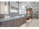 Modern main bathroom with double vanity, contemporary lighting, and ample counter space at 37200 N Cave Creek Rd # 1019, Scottsdale, AZ 85262