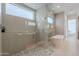 Luxurious walk-in shower and free standing tub in primary bath at 37200 N Cave Creek Rd # 1019, Scottsdale, AZ 85262