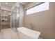 Spa-like main bathroom featuring a soaking tub, walk-in shower, and stylish tile work at 37200 N Cave Creek Rd # 1019, Scottsdale, AZ 85262
