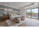 Serene main bedroom with pool access, sleek furnishings, and plenty of natural light at 37200 N Cave Creek Rd # 1019, Scottsdale, AZ 85262