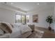 Comfortable main bedroom with seating area and large windows offering views of outdoor space at 37200 N Cave Creek Rd # 1019, Scottsdale, AZ 85262