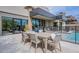 Elegant outdoor dining area next to a sparkling pool, perfect for entertaining or relaxing at 37200 N Cave Creek Rd # 1019, Scottsdale, AZ 85262