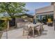 Outdoor dining area featuring a modern table, grill, and beautiful landscaping at 37200 N Cave Creek Rd # 1019, Scottsdale, AZ 85262