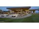 Beautiful outdoor patio with a fire pit, seating area, and desert landscaping at 37200 N Cave Creek Rd # 1019, Scottsdale, AZ 85262