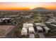 Stunning aerial view of a desert community showcasing the modern architecture and beautiful mountain views at 37200 N Cave Creek Rd # 1034, Scottsdale, AZ 85262