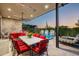 Inviting backyard featuring a pool, outdoor dining area, fire feature, and modern patio at 37200 N Cave Creek Rd # 1034, Scottsdale, AZ 85262