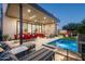 Beautiful backyard featuring a pool, dining area, outdoor seating, and modern patio design at 37200 N Cave Creek Rd # 1034, Scottsdale, AZ 85262