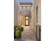 Inviting entryway with desert plants, stone pavers, and courtyard access at 37200 N Cave Creek Rd # 1034, Scottsdale, AZ 85262
