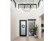 Grand two-story foyer with modern lighting, a frosted door, and a view into the living space at 37200 N Cave Creek Rd # 1034, Scottsdale, AZ 85262