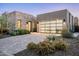 Beautiful single-Gathering home with stone veneer and stylish glass garage doors at 37200 N Cave Creek Rd # 1034, Scottsdale, AZ 85262