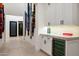 Bright hallway with decorative art, featuring a built-in wet bar and wine fridge at 37200 N Cave Creek Rd # 1034, Scottsdale, AZ 85262