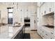 Island kitchen features granite countertops, undermount sink, bar seating and stainless steel appliances at 37200 N Cave Creek Rd # 1034, Scottsdale, AZ 85262