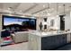 Open-concept living space with large sliding glass doors and mountain views at sunset at 37200 N Cave Creek Rd # 1034, Scottsdale, AZ 85262