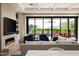 Bright living room featuring a fireplace, modern furnishings, and mountain views at 37200 N Cave Creek Rd # 1034, Scottsdale, AZ 85262