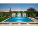 Picturesque pool featuring a waterfall feature and lush landscaping for ultimate backyard enjoyment at 37200 N Cave Creek Rd # 1034, Scottsdale, AZ 85262