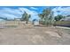Spacious backyard with a large shed behind a brick privacy wall at 3827 N 88Th Ln, Phoenix, AZ 85037