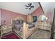 This bedroom includes a bed, ceiling fan, dresser, night stand and closet at 3827 N 88Th Ln, Phoenix, AZ 85037