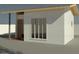 The casita has a simple, modern design with an entry area and a large window to provide lots of light at 3827 N 88Th Ln, Phoenix, AZ 85037
