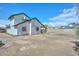 Rear exterior view of home with large yard, and blue sky at 3827 N 88Th Ln, Phoenix, AZ 85037