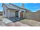 Back exterior featuring a patio and brick privacy wall at 3827 N 88Th Ln, Phoenix, AZ 85037