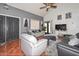 Inviting living room with tile floors, high ceilings, and stylish furnishings at 3827 N 88Th Ln, Phoenix, AZ 85037