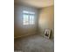 Cozy bedroom with carpet, neutral wall paint, and a window is a comfortable space for sleep and relaxation at 4136 N 113Th Dr, Phoenix, AZ 85037