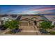 Aerial shot showcasing this single-story home with solar panels, three-car garage, and well-maintained landscaping at 4361 S Electron --, Mesa, AZ 85212
