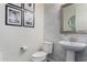 Stylish powder room featuring elegant wallpaper and modern fixtures at 4361 S Electron --, Mesa, AZ 85212