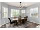 Dining room with natural light, shutters, ceiling fan, and seating for six at 4361 S Electron --, Mesa, AZ 85212