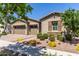 Charming desert home with a three-car garage and front desert landscaping at 4361 S Electron --, Mesa, AZ 85212